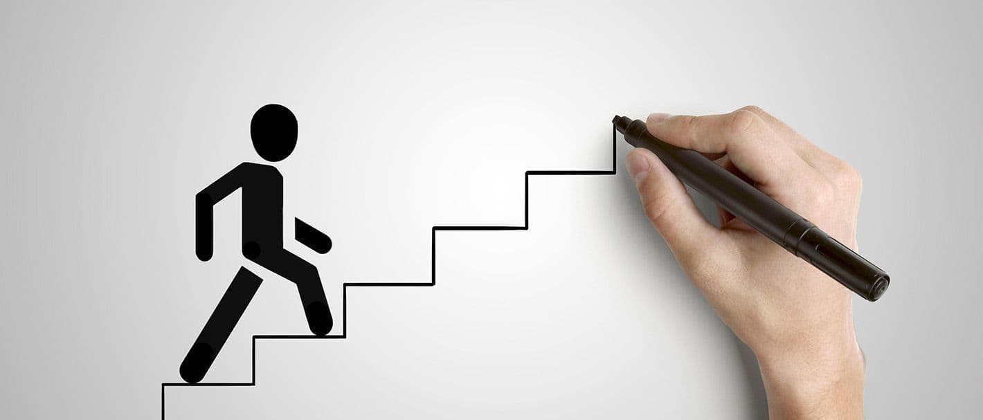 Hand draws a staircase while a stick figure runs up it